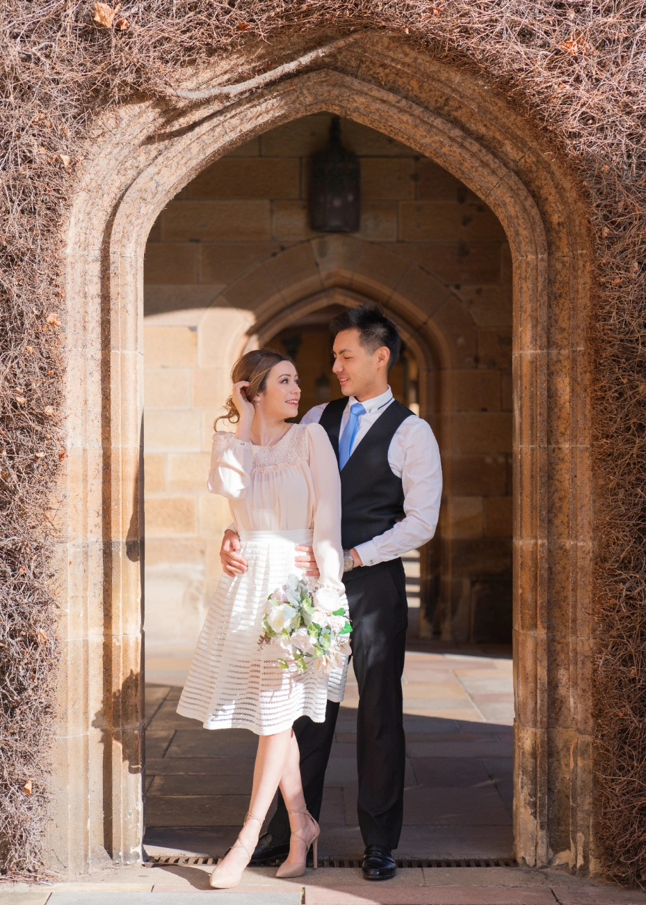 Bride and groom at the sandstone arch